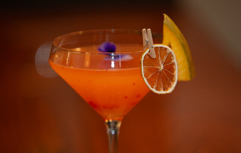 Craft cocktail with a dried orange wheel