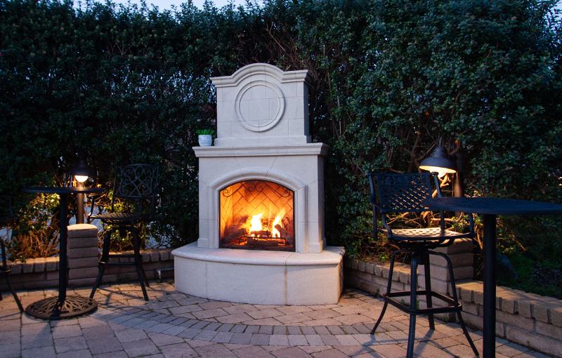 Outdoor fireplace on the patio at night